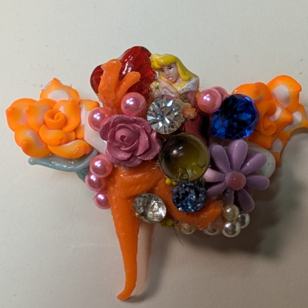 Wendy Gell pop art pin Cinderella Tyrannosaurus Rex with jewels and flowers.